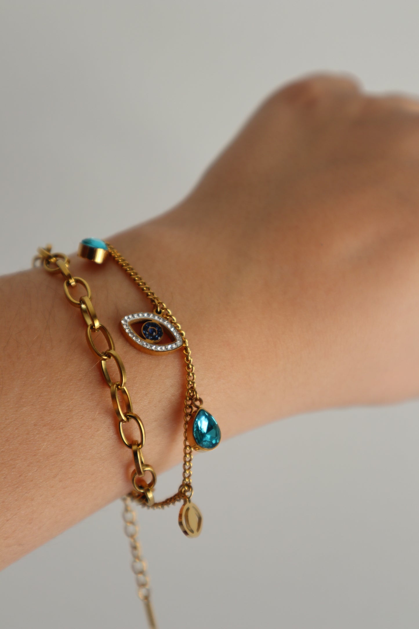 Pulseira dupla com cristais e olho
