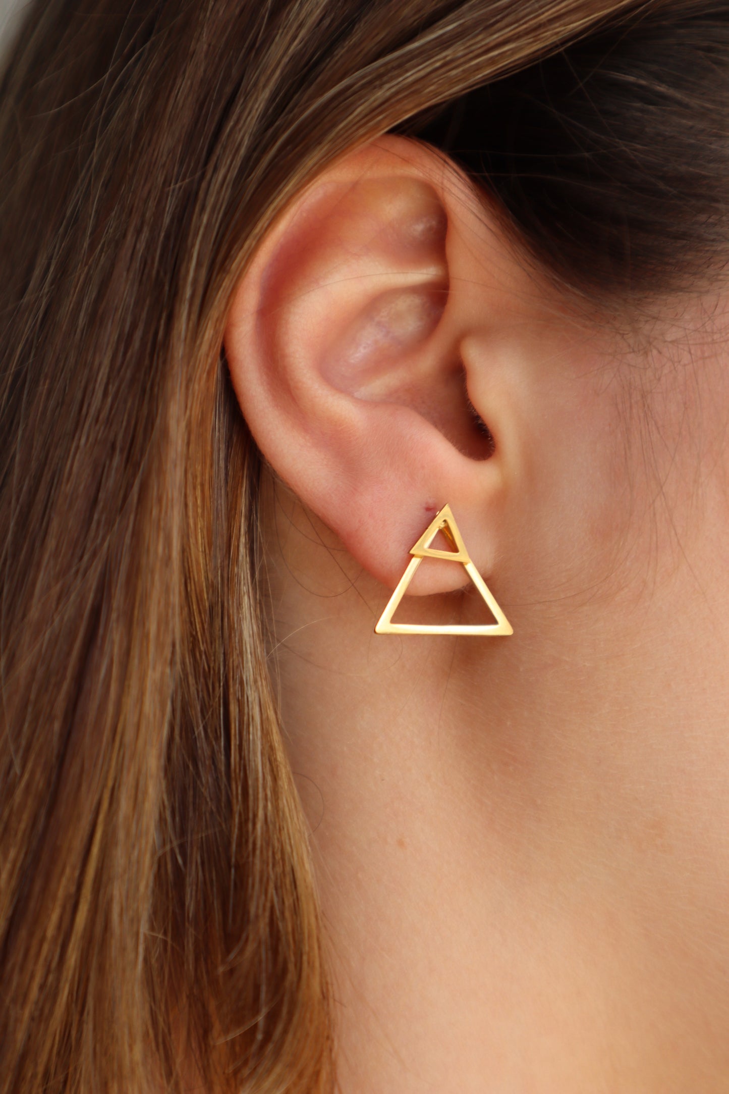 Brincos triangulares