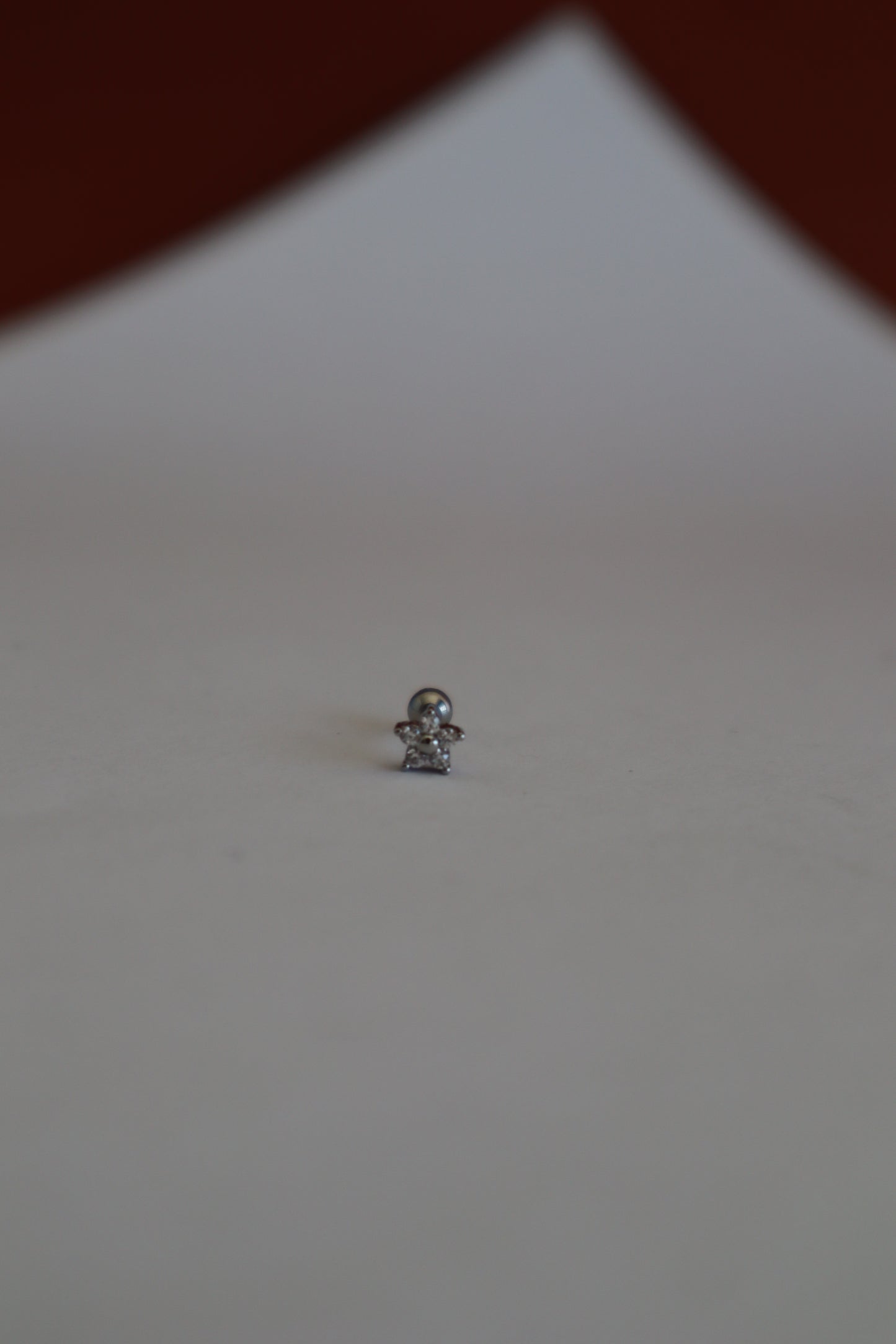 Piercing flor brilhante